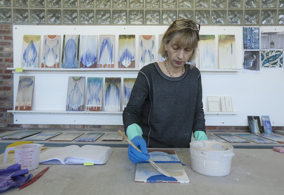 Cary Esser glazes ceramic tiles for a new series of work titled 