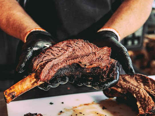 Pitmaster John Atwell of Jousting Pigs BBQ in Liberty does a Texas-style smoked brisket that exemplifies the motto “competition meets craft.”
