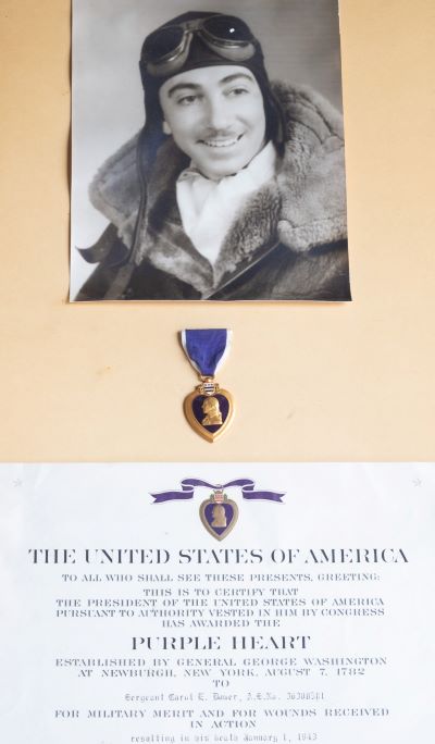A photo of Sgt. Carol Eugene Domer and his Purple Heart.