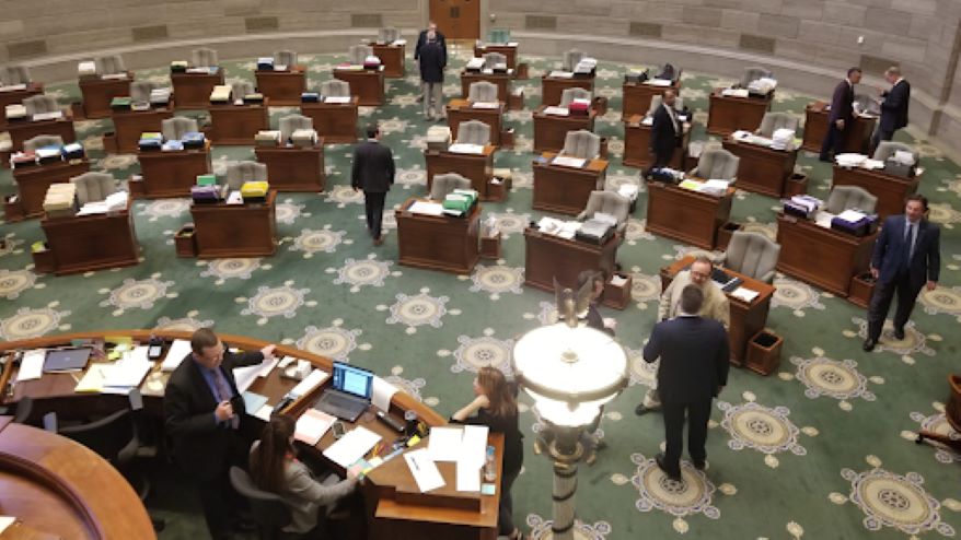 A few stragglers collect their papers in the Missouri Senate after the body adjourned in May four hours ahead of the constitutional deadline