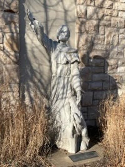 A St. Francis statue on the grounds of St. Peter’s Catholic Church and School is dedicated to Frank McGonigle’s memory.