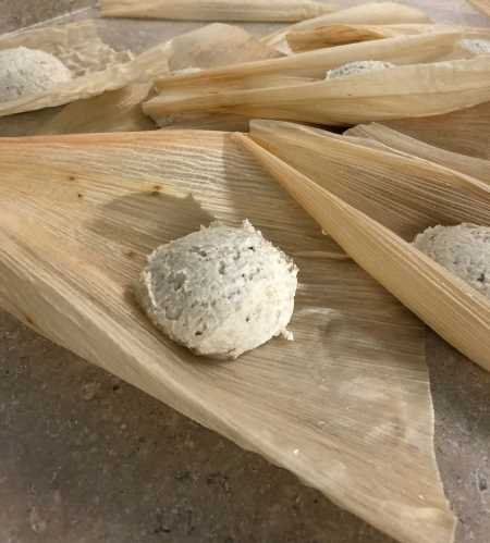 Masa before it is spread on the husk, filled and folded for steaming.