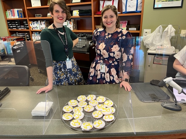 Emily Wildhaber (left) and Chelsea Clarke, assistant branch managers at the Midwest Genealogy Center, celebrated the April 1 release of 1950 Census data by offering patrons root beer and cookies bearing the number “50.”