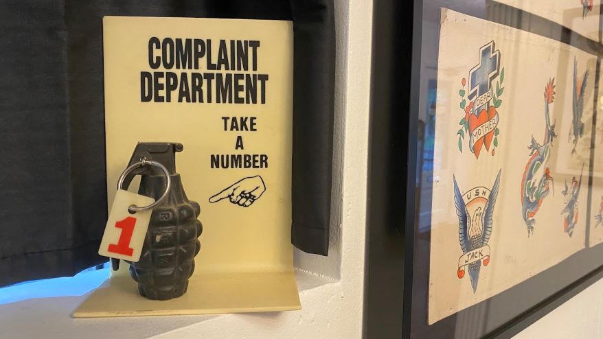 The ‘Complaint Department’ in the Bert Grimm Tattoo Museum features a hand grenade.