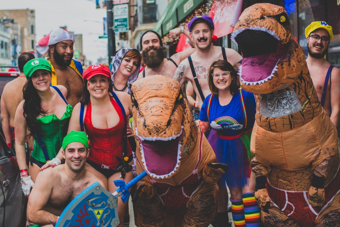 Runners pose in underwear and costumes. 