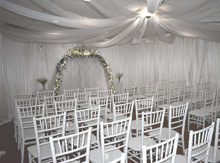 Empty chairs sit in wedding chapel.