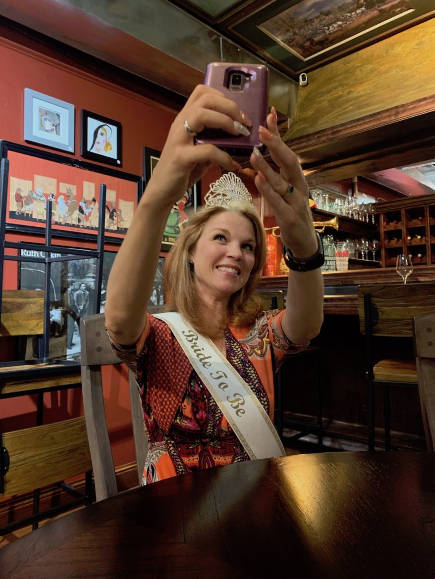 Stacy snaps a selfie in a tiara and 'Bride To Be' sash. 