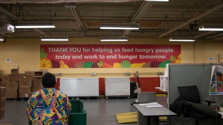 A woman shops for food at Harvesters