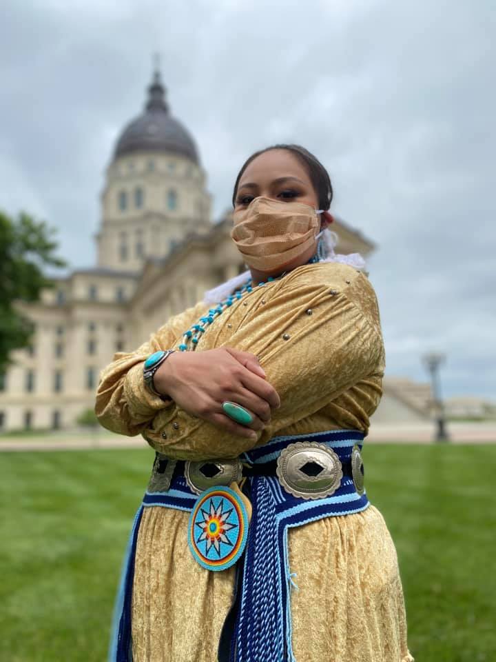 Haswood poses in front of the Capitol building in Topeka, Kansas.