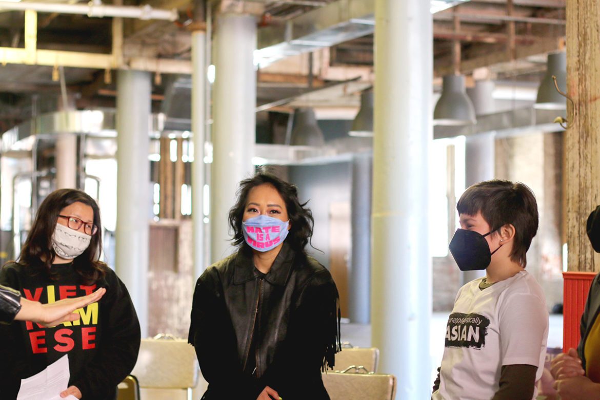 Jackie Nguyen (center) meets with two of the vigil speakers before it began. (Nicole Dolan | Flatland)