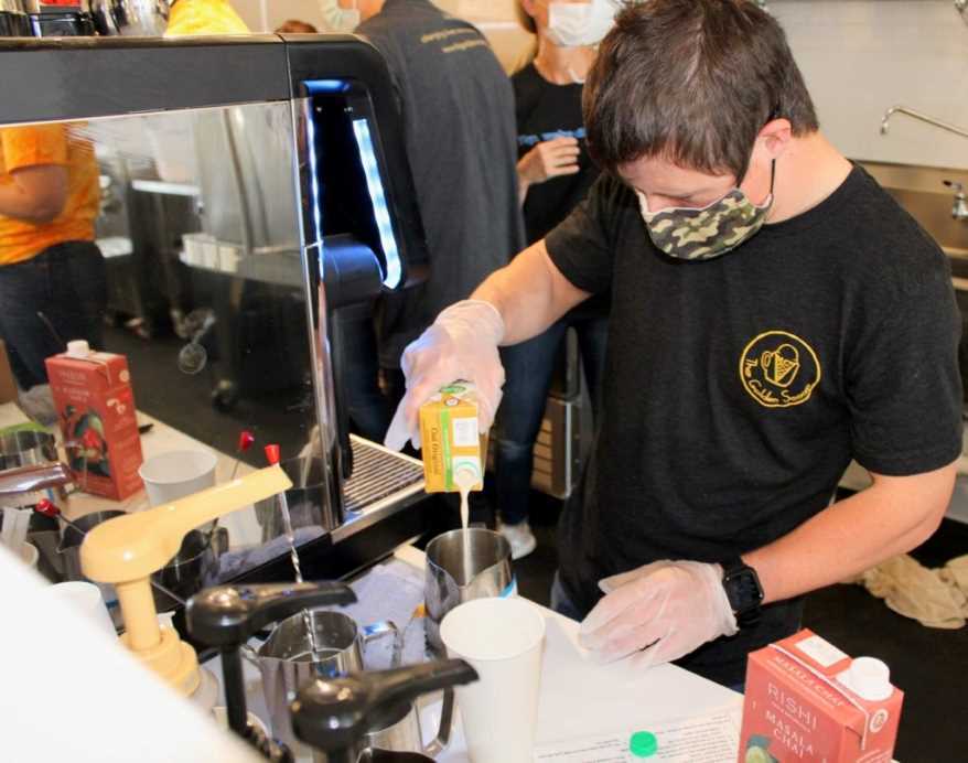 Patrick Chapman enjoys making coffee drinks for customers at The Golden Scoop.