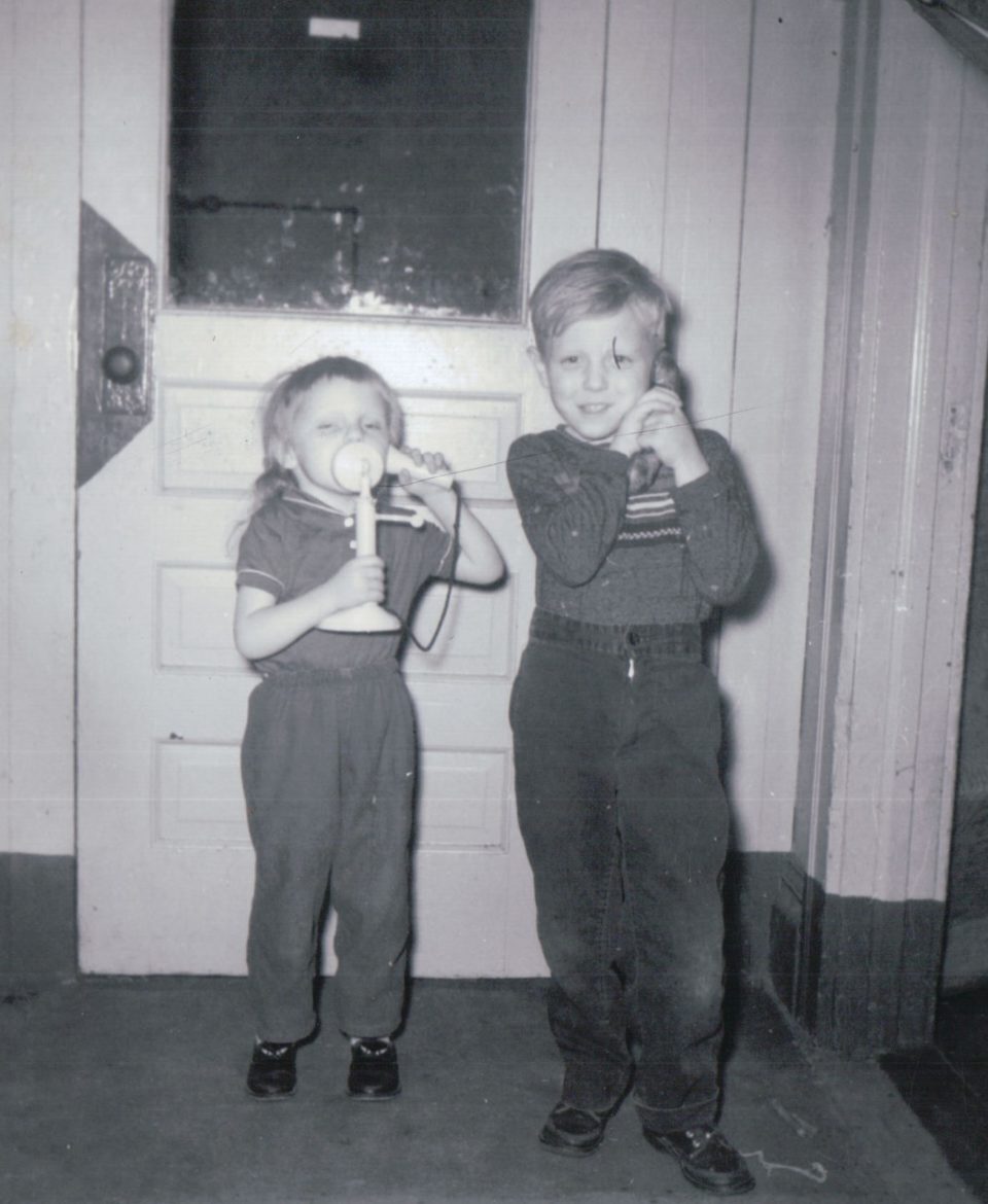 Della and George play with hotel phones. (Courtesy | Della Reynolds)