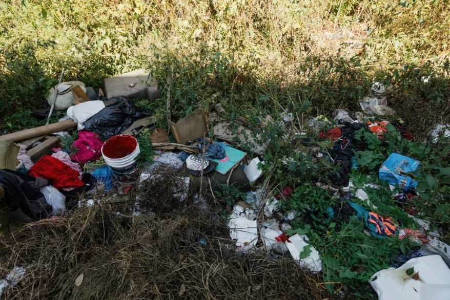 Furniture, tires, clothing, building supplies and trash litter the lot at 527 Indiana Ave. in Kansas City, Missouri.