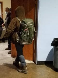 Bundled up against the cold, a man walks into the hall where a breakfast will soon be served at the Cathedral of the Immaculate Conception, which serves between 100-200 people each weekday through the parish’s Morning Glory Ministries.