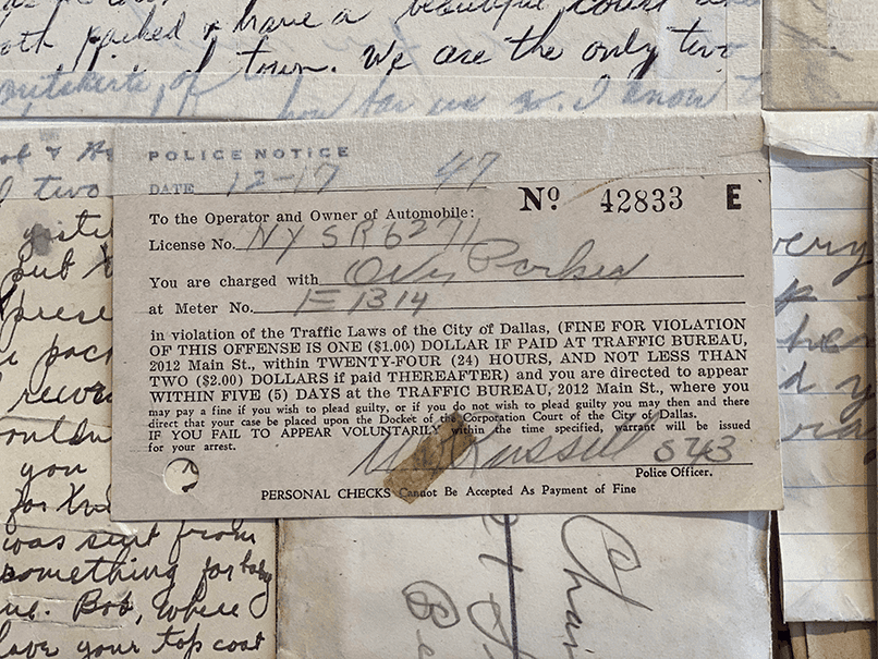 A handwritten police notice in what appears to be pencil.