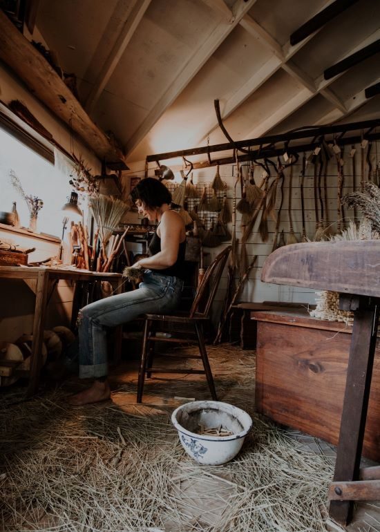 Amanda Lee Lazorchack at work making brooms.