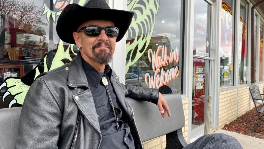 Wes Grimm in front of his shop.